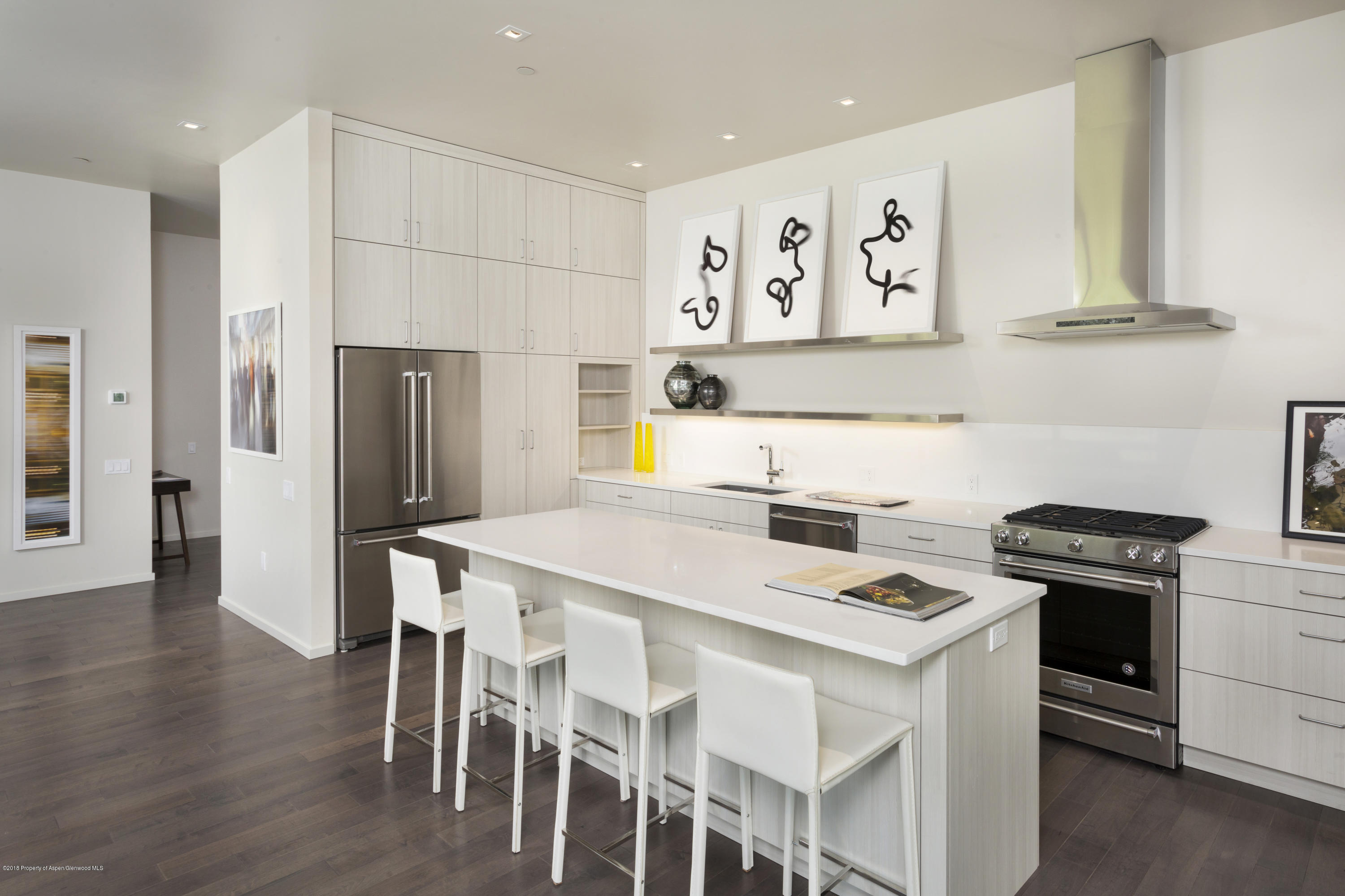 100 Evans Road, Unit 202 Basalt, CO 81621 - Photo 9 of 25 a kitchen that has a table and chairs in it