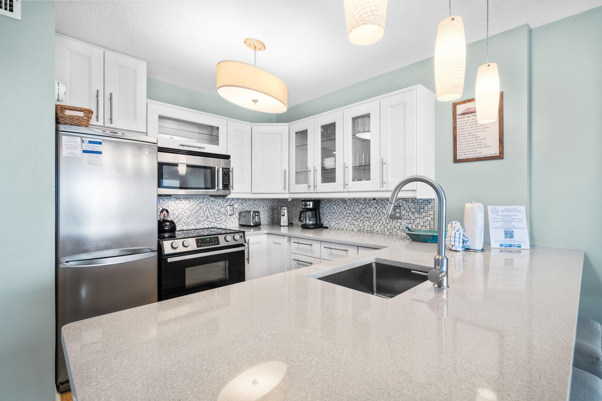 8294 East County Highway 30A, Unit 1 Inlet Beach, FL 32461 - Photo 11 of 45 a kitchen with stainless steel appliances granite countertop a sink stove and refrigerator