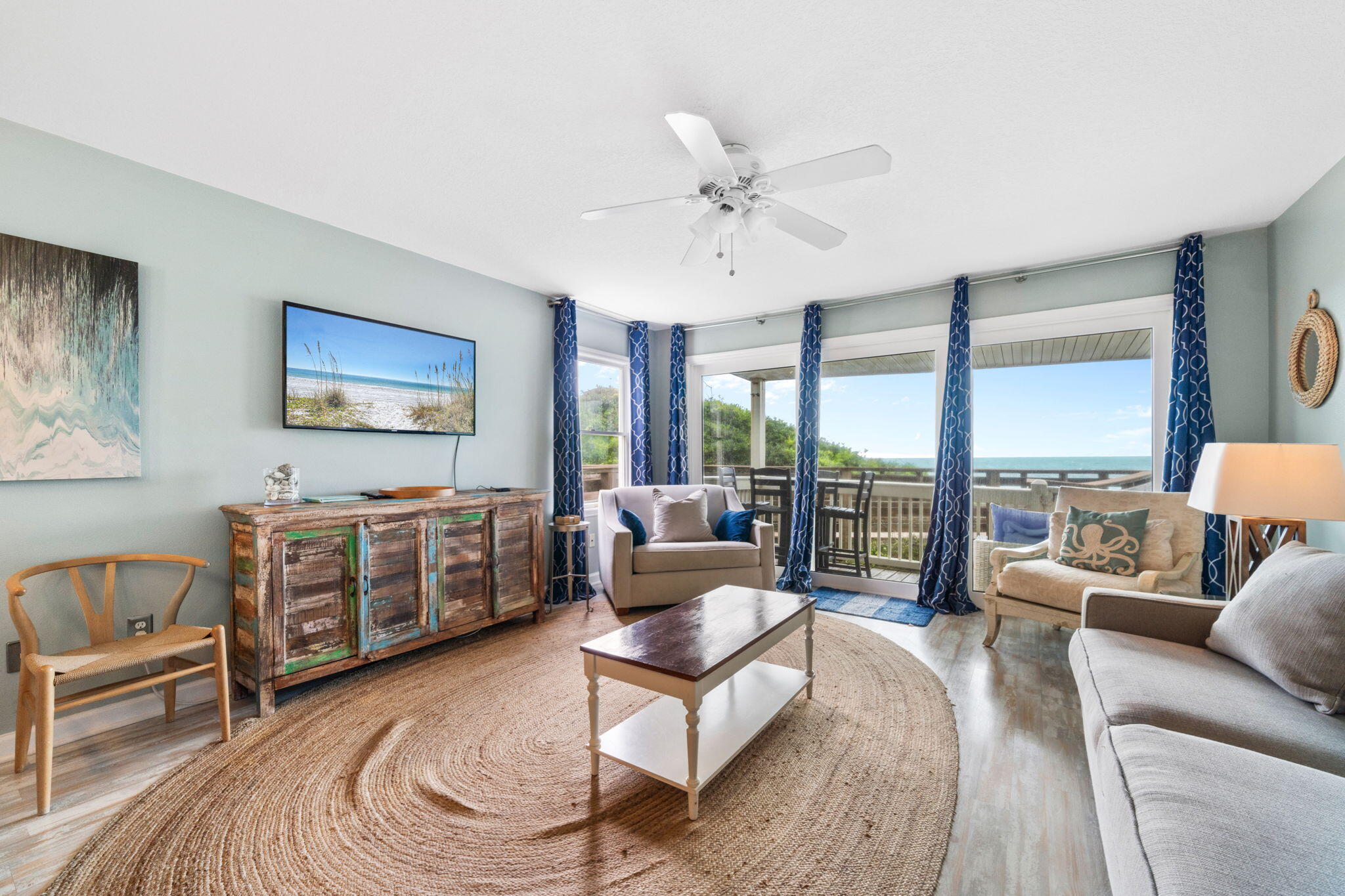 8294 East County Highway 30A, Unit 1 Inlet Beach, FL 32461 - Photo 13 of 45 a living room with furniture and a floor to ceiling window