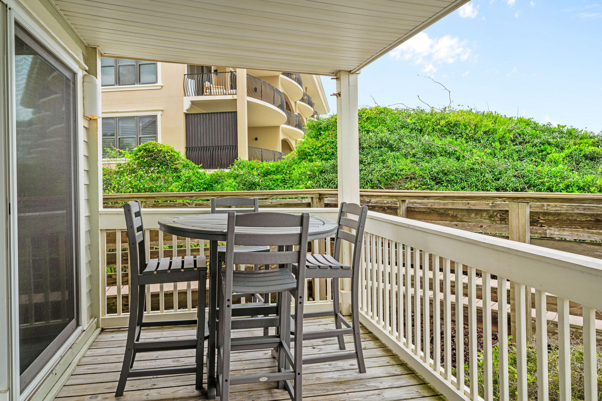 8294 East County Highway 30A, Unit 1 Inlet Beach, FL 32461 - Photo 19 of 45 a view of a chair and table in the balcony