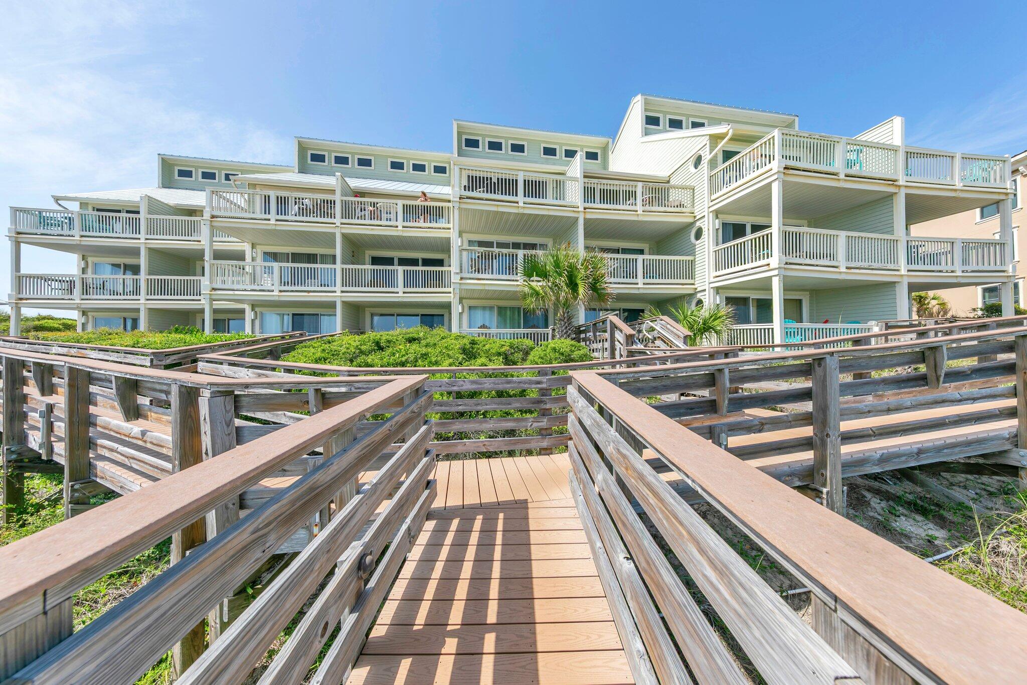 8294 East County Highway 30A, Unit 1 Inlet Beach, FL 32461 - Photo 33 of 45 a view of a balcony with a large window and wooden floor