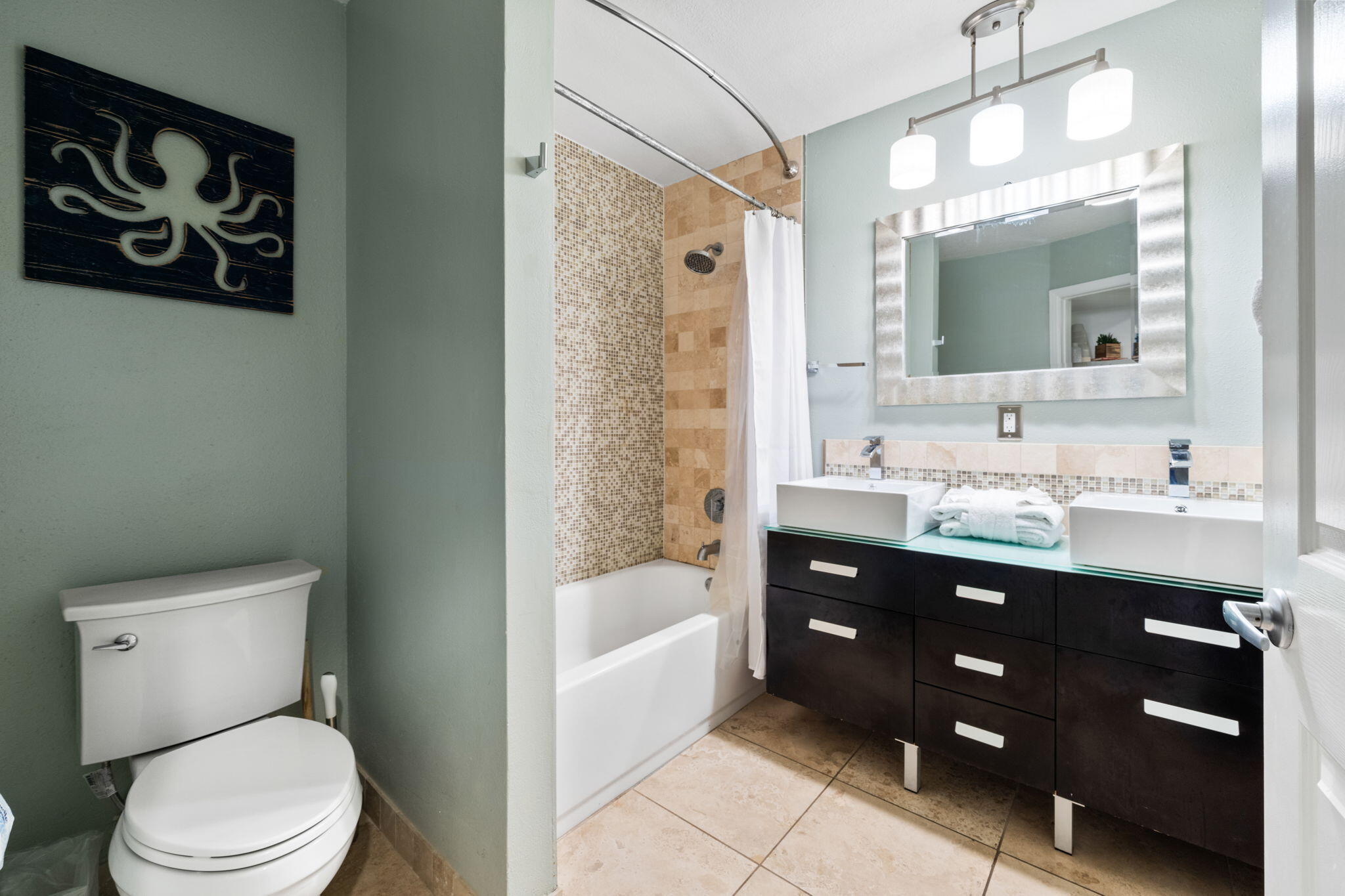 8294 East County Highway 30A, Unit 1 Inlet Beach, FL 32461 - Photo 5 of 45 a bathroom with a toilet a sink a mirror a bathtub and vanity