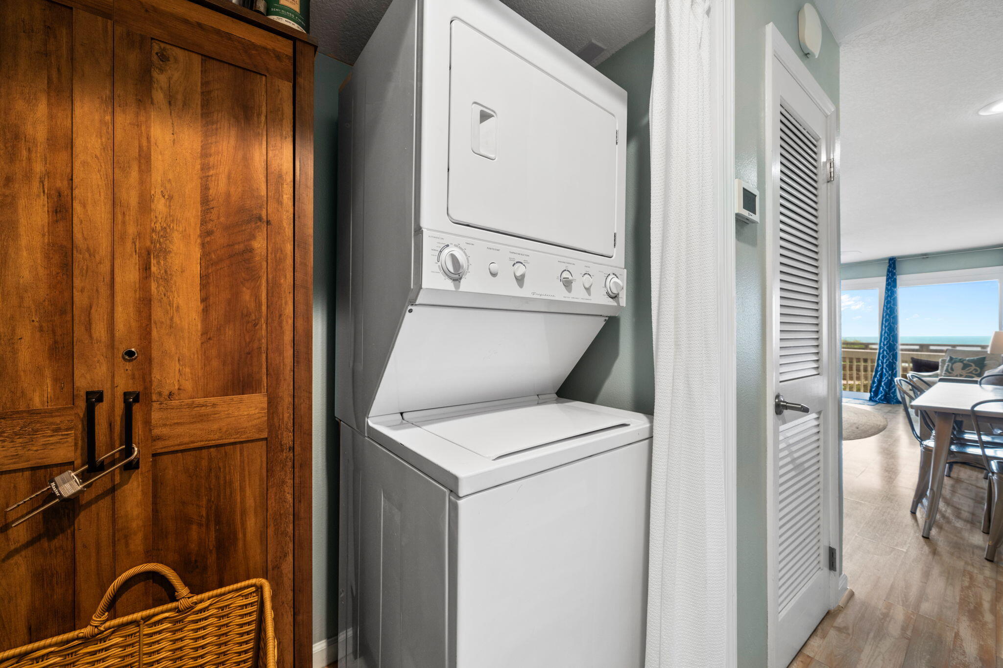 8294 East County Highway 30A, Unit 1 Inlet Beach, FL 32461 - Photo 6 of 45 a view of washer and dryer with wooden floor