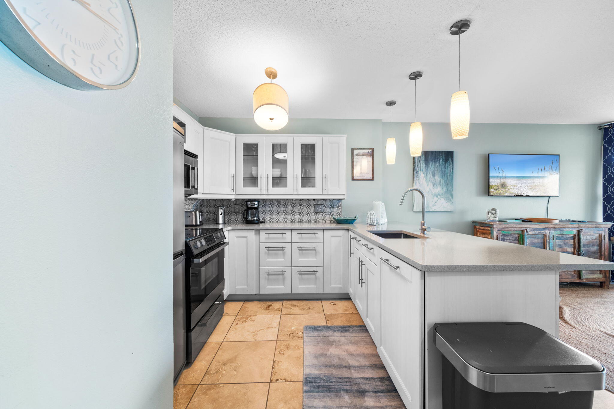 8294 East County Highway 30A, Unit 1 Inlet Beach, FL 32461 - Photo 8 of 45 a large white kitchen with a sink and dishwasher a stove with wooden floor
