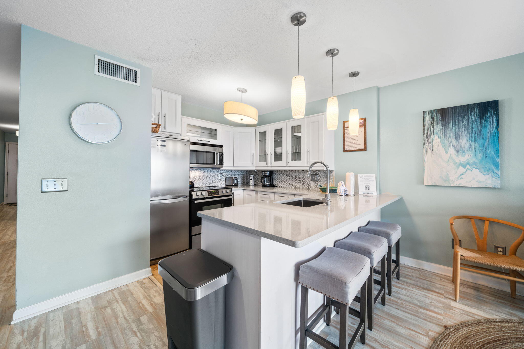 8294 East County Highway 30A, Unit 1 Inlet Beach, FL 32461 - Photo 10 of 45 a kitchen that has a table chairs and a refrigerator