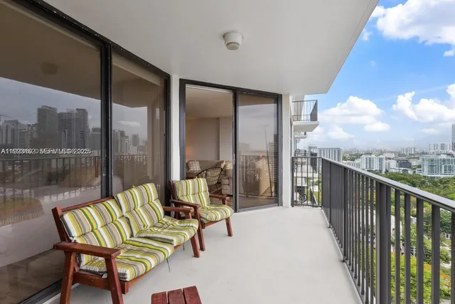 a kitchen with cabinets appliances and a center island