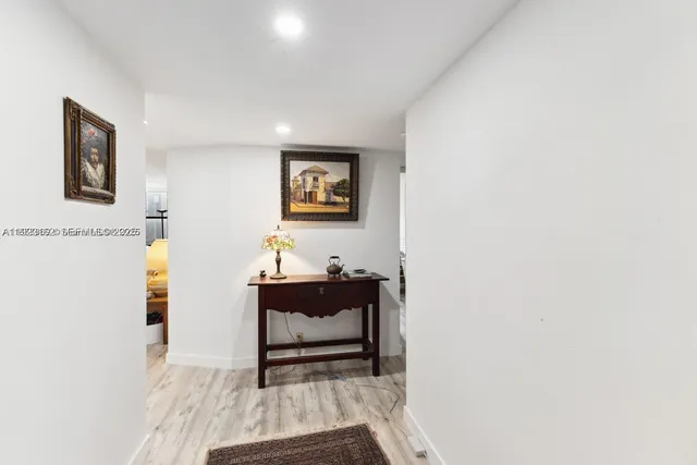 a bedroom with two beds and glass window
