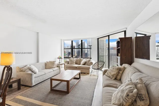 a living room with furniture and a lamp
