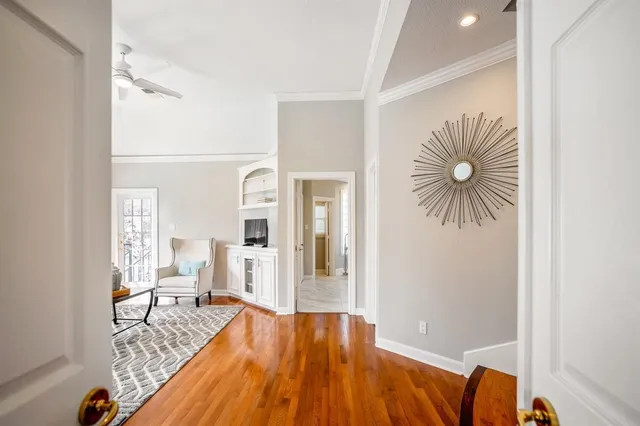 a living room with fireplace furniture and a flat screen tv
