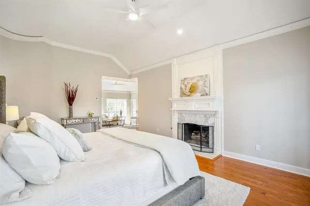 a spacious bedroom with a bed and a couch