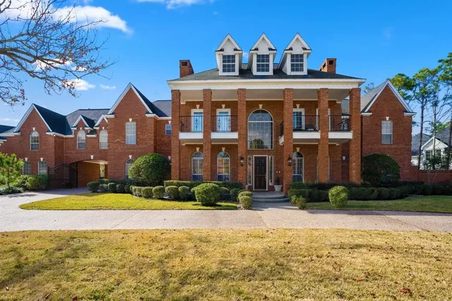 a front view of a house with swimming pool