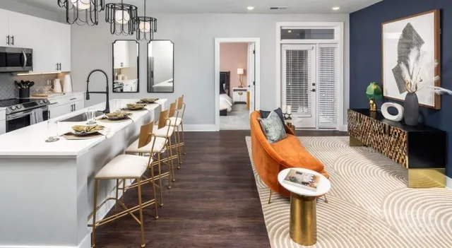 a kitchen with a dining table and chairs