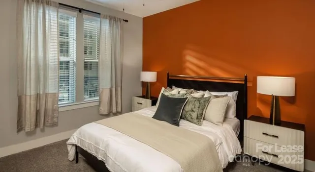 a en suite bathroom with a sink a mirror and a bathtub