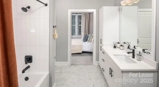 a bedroom with a bed and a mirror