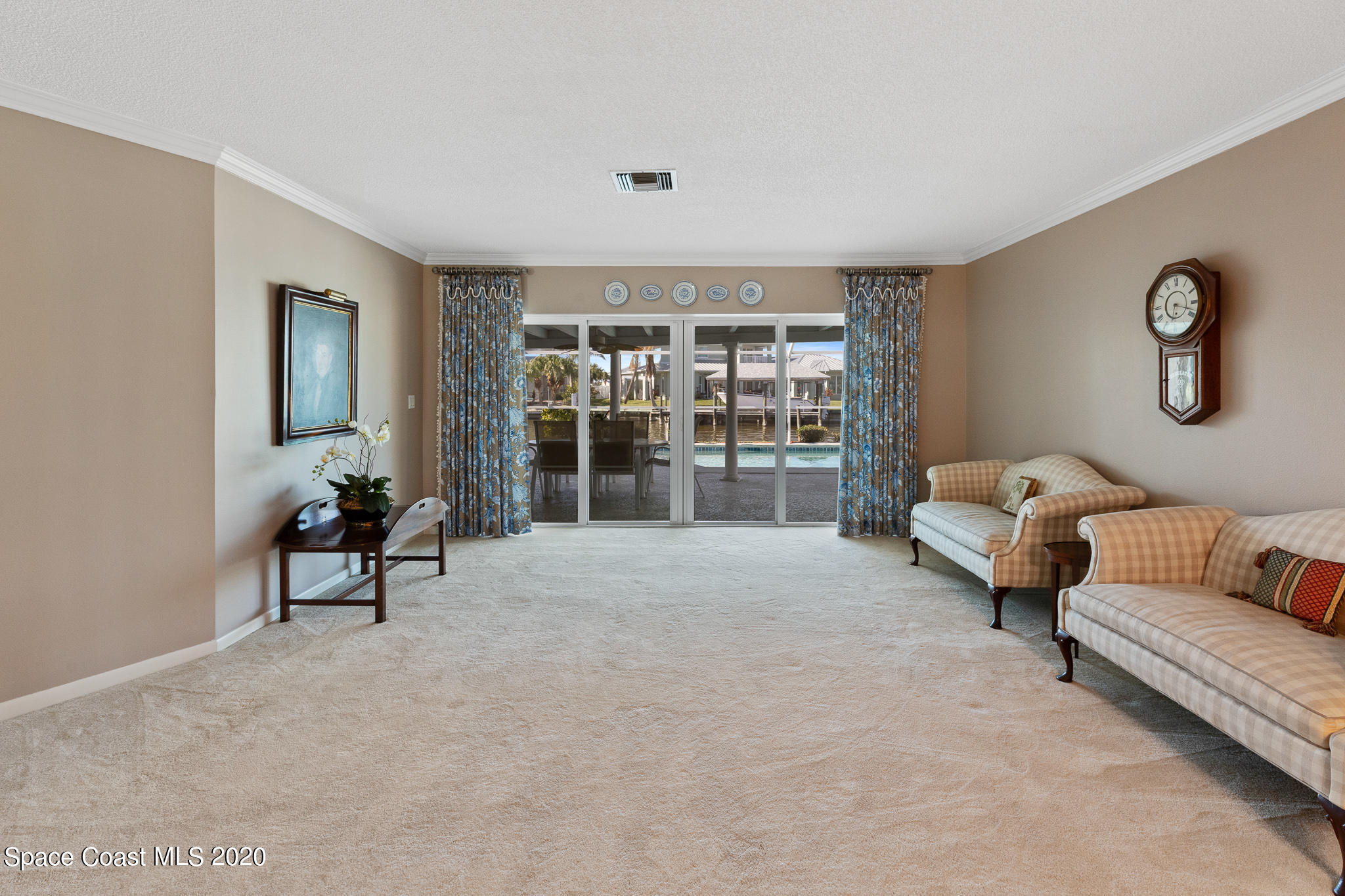 43 Country Club Road Cocoa Beach, FL 32931 - Photo 11 of 35 a living room with furniture and a window