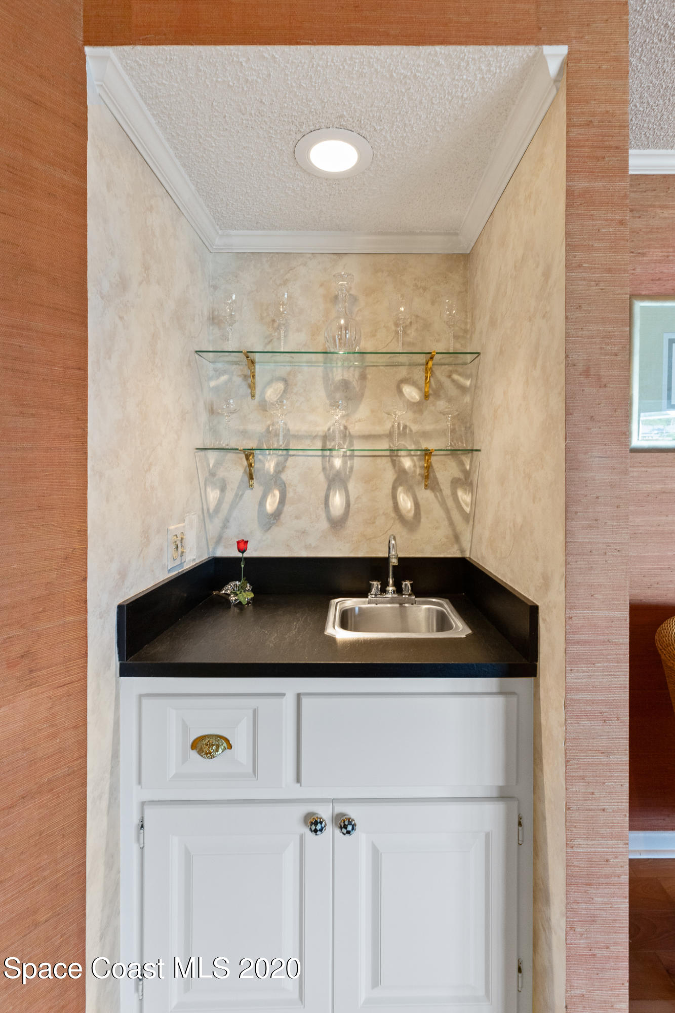 43 Country Club Road Cocoa Beach, FL 32931 - Photo 16 of 35 a bathroom with a sink and a mirror