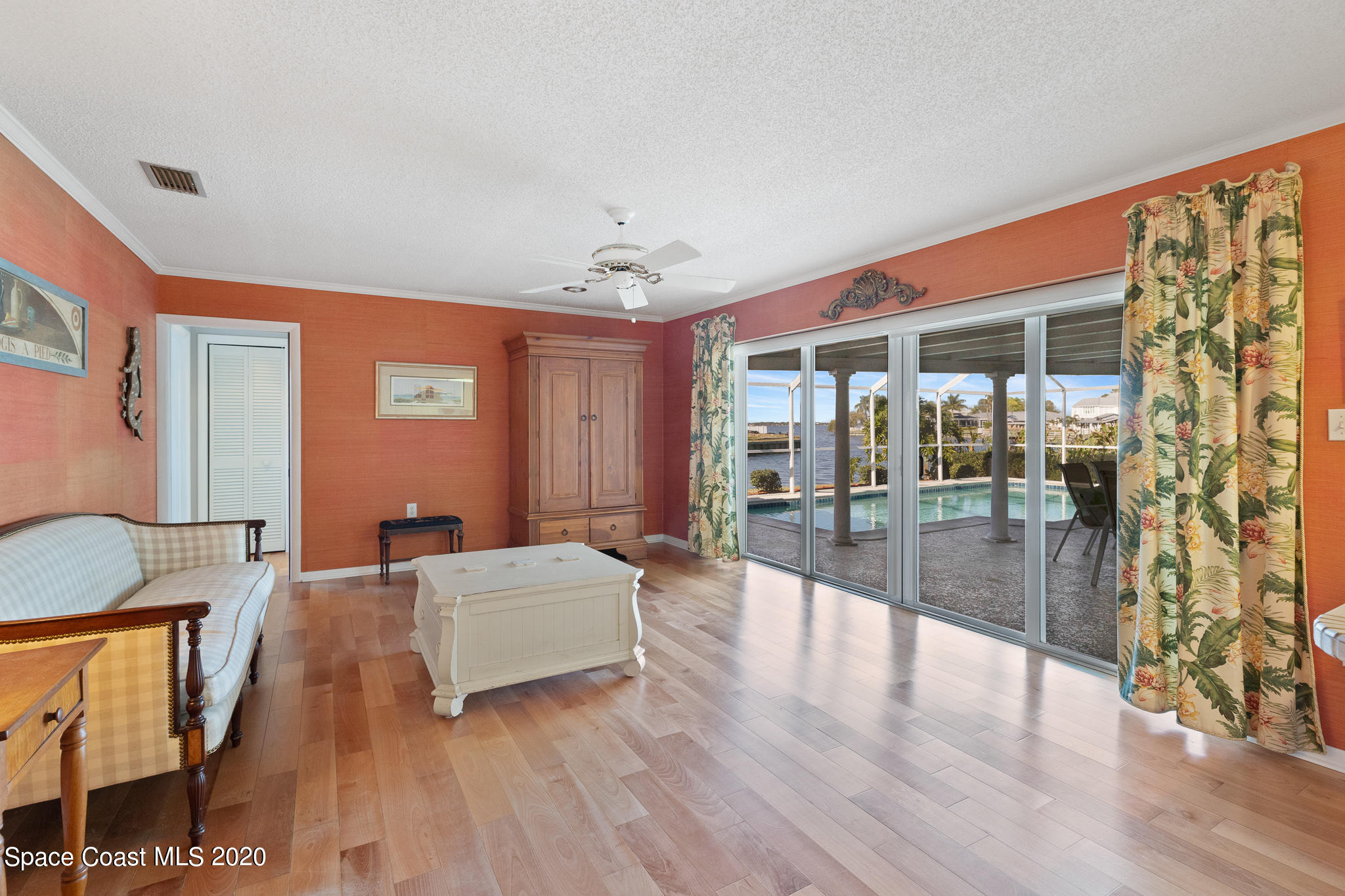 43 Country Club Road Cocoa Beach, FL 32931 - Photo 17 of 35 a living room with furniture and wooden floor