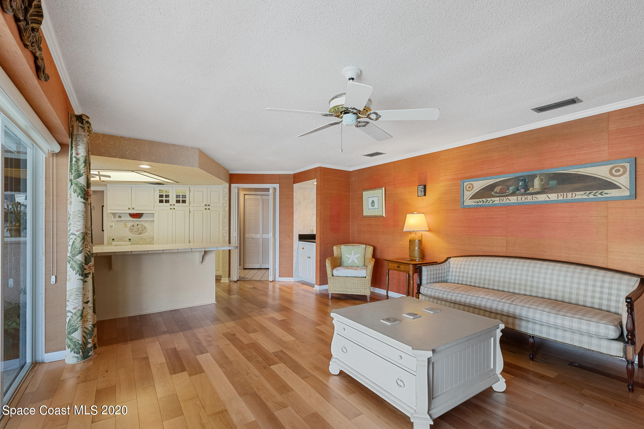 43 Country Club Road Cocoa Beach, FL 32931 - Photo 18 of 35 a living room with furniture and a chandelier