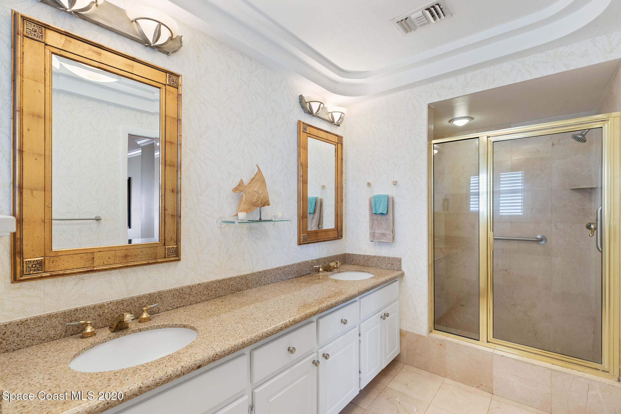 43 Country Club Road Cocoa Beach, FL 32931 - Photo 21 of 35 a bathroom with a granite countertop double vanity sink mirror and shower
