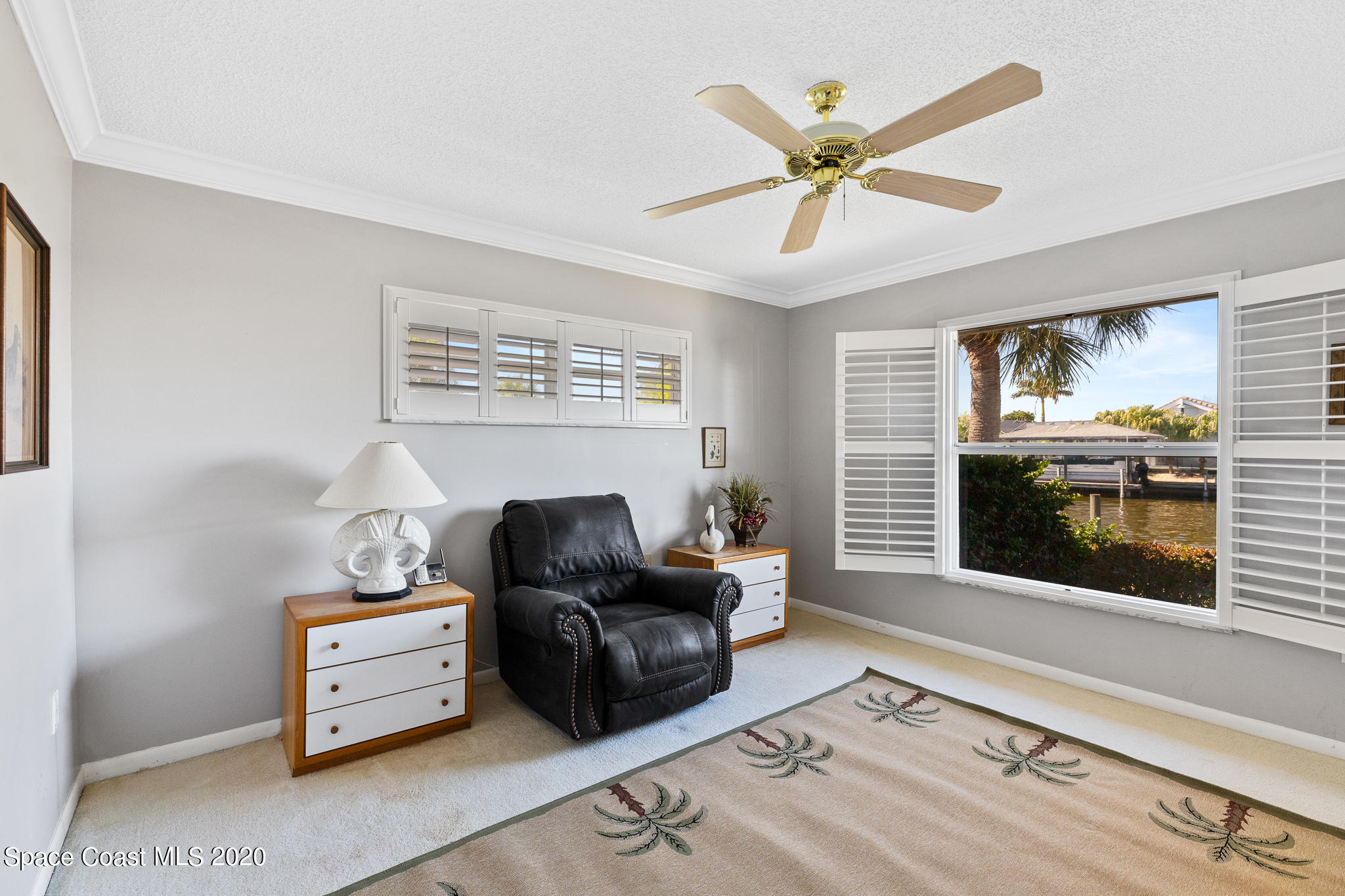 43 Country Club Road Cocoa Beach, FL 32931 - Photo 26 of 35 a living room with furniture and a flat screen tv