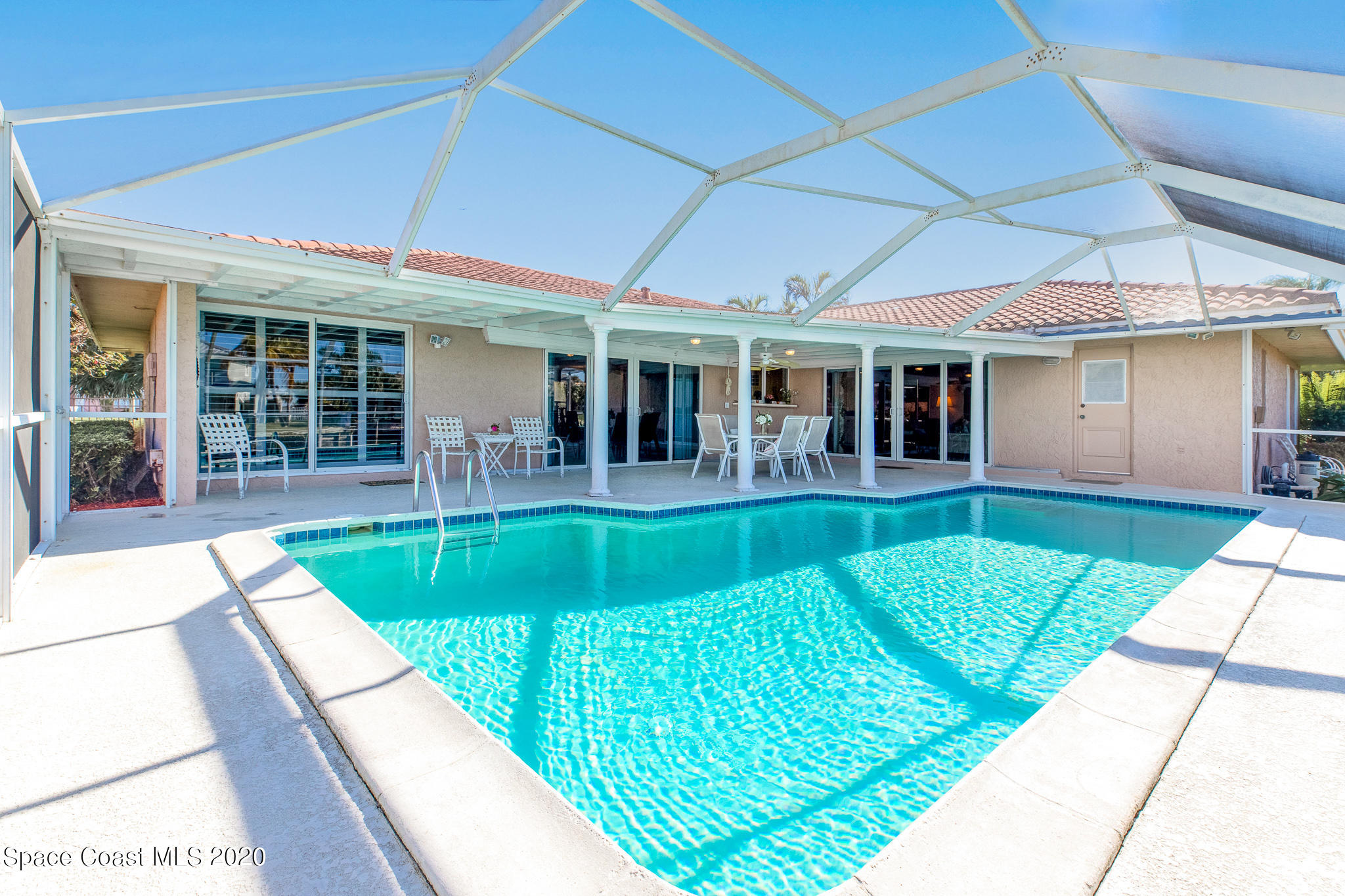 43 Country Club Road Cocoa Beach, FL 32931 - Photo 29 of 35 a view of a house with a backyard