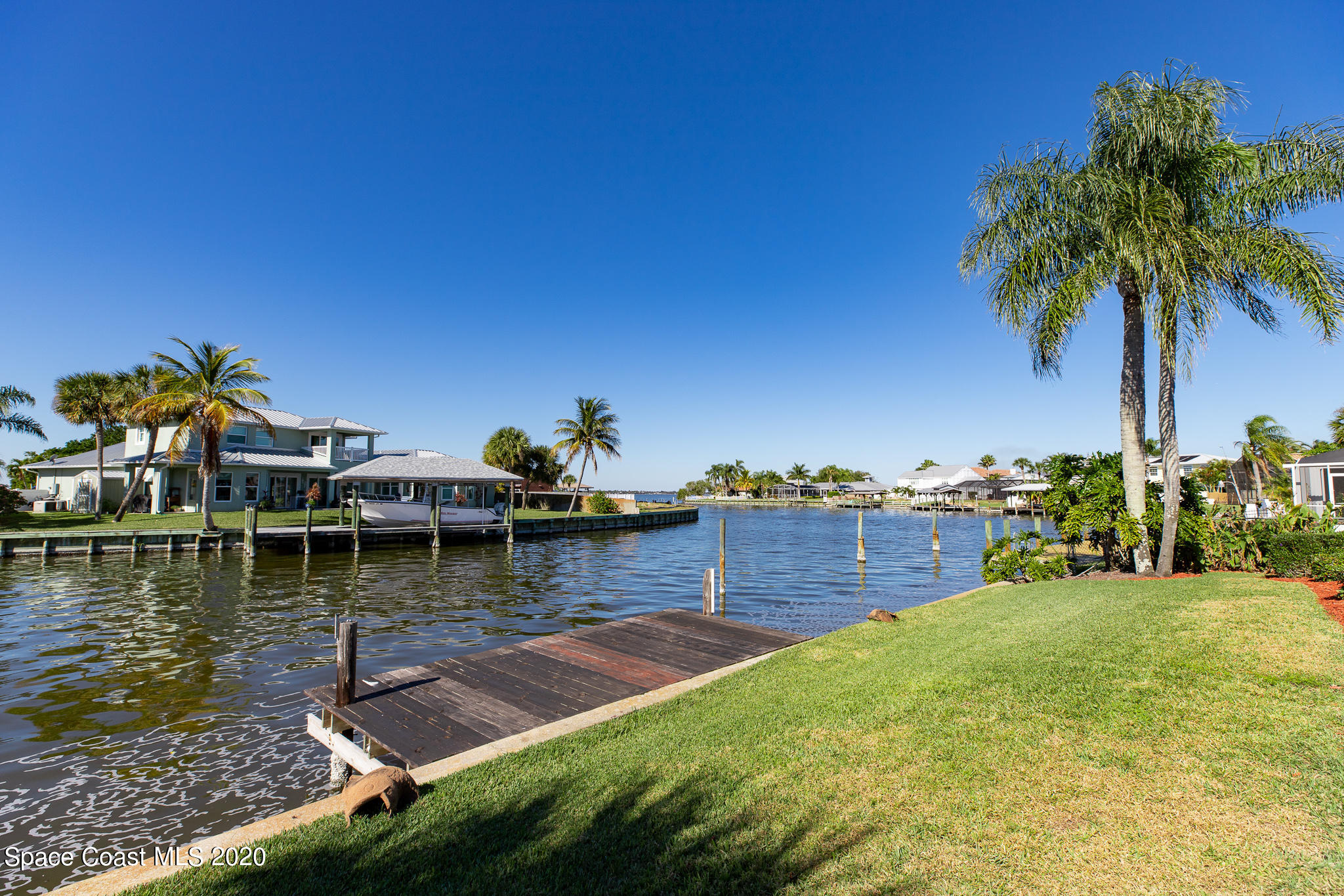 43 Country Club Road Cocoa Beach, FL 32931 - Photo 31 of 35 a view of a lake with houses