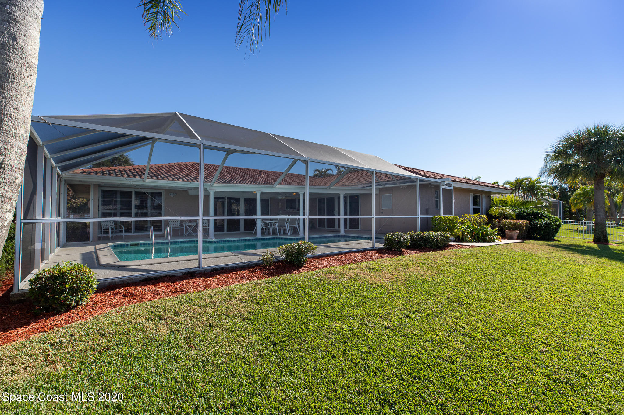 43 Country Club Road Cocoa Beach, FL 32931 - Photo 33 of 35 a view of a house with a backyard