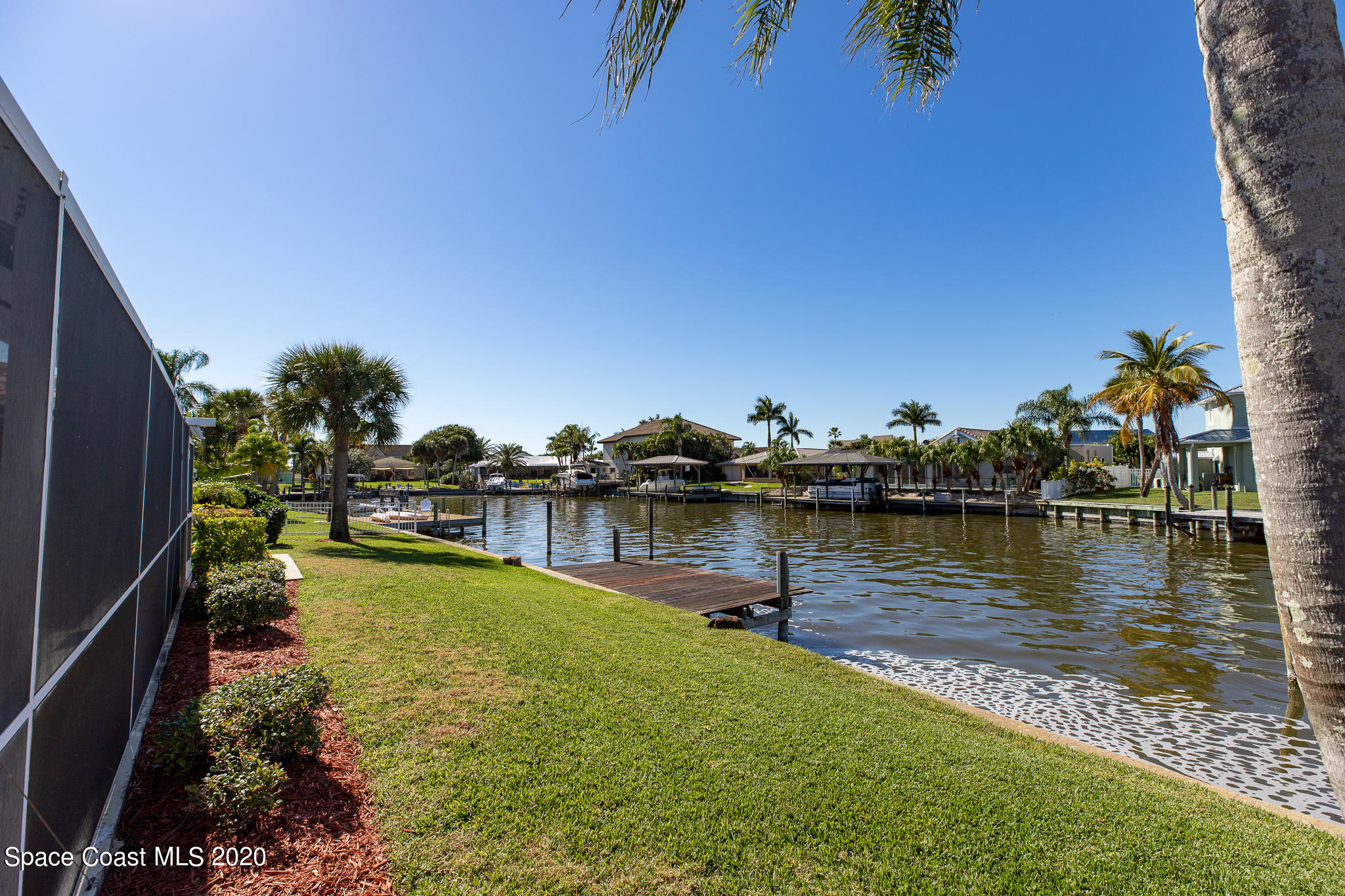 43 Country Club Road Cocoa Beach, FL 32931 - Photo 34 of 35 a view of a lake with houses
