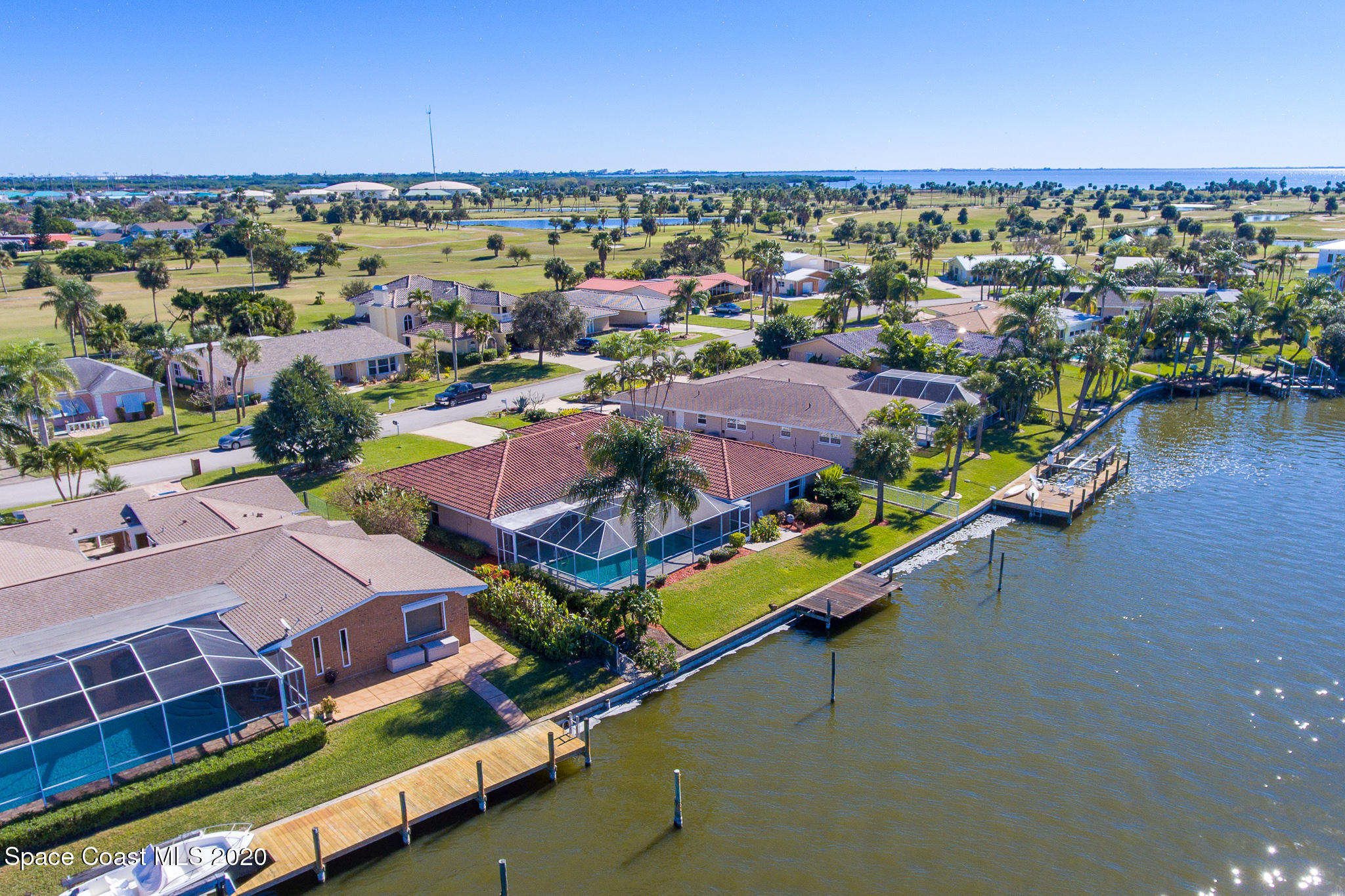 43 Country Club Road Cocoa Beach, FL 32931 - Photo 6 of 35 an aerial view of a houses with a lake view