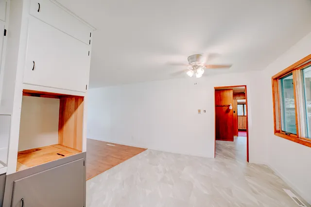 a view of an entryway with wooden floor