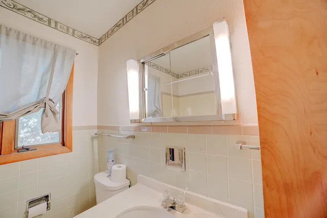 a bathroom with a toilet a sink and a bathtub