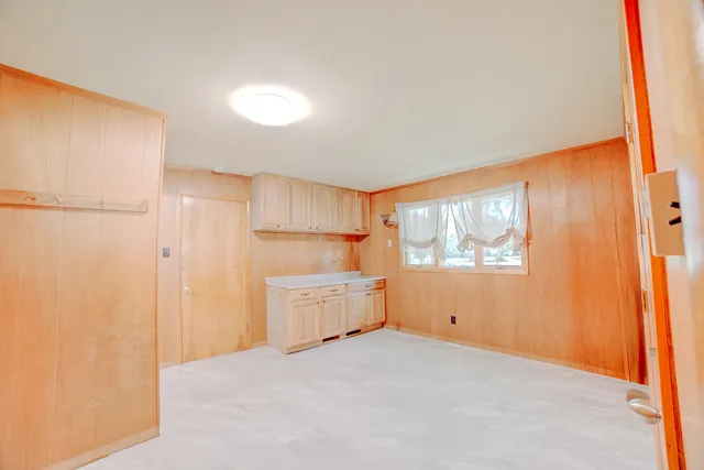 a room with a bed and a window