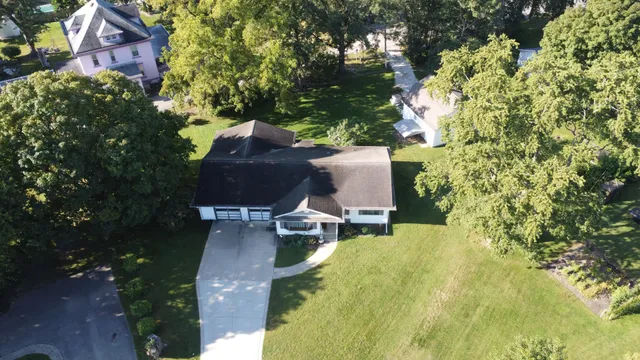 a view of a backyard with sitting area