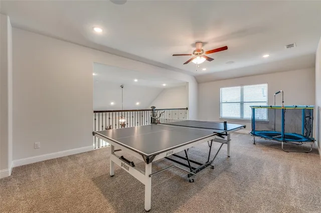 a living room with furniture gym equipment and a window