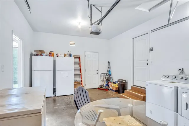 a bedroom with furniture and white walls