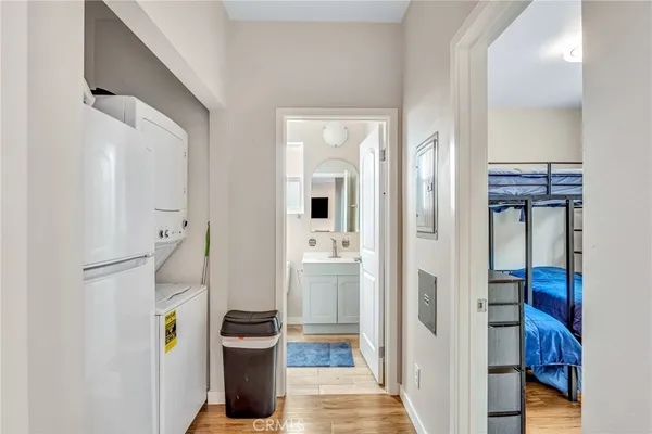 a view of hallway with wooden floor