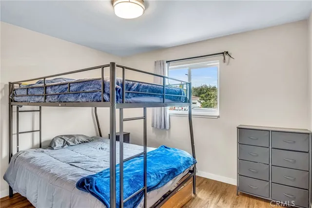 a bed room with a bed and a window