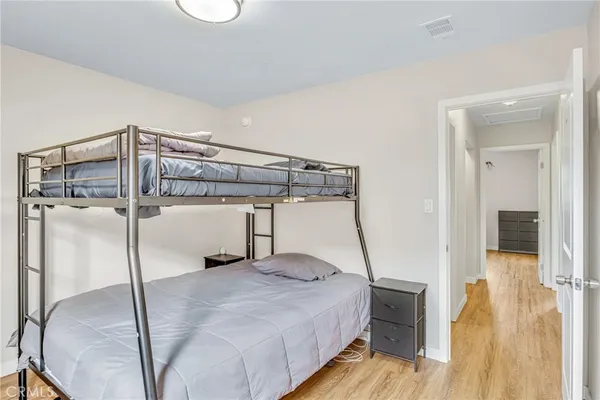 a bedroom with a bed and a table