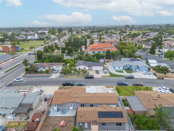 an aerial view of residential houses with outdoor space