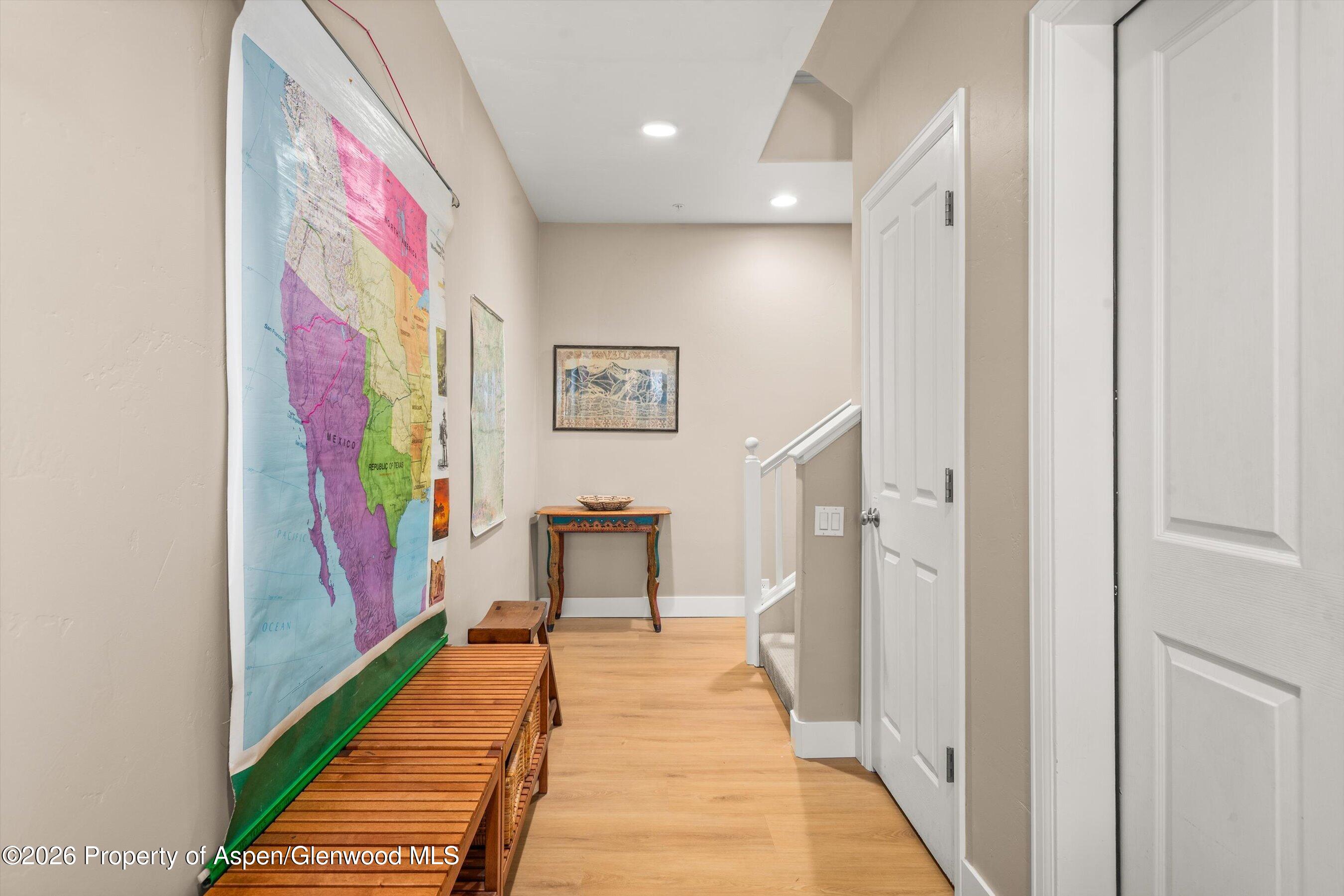 546 Evans Court Basalt, CO 81621 - Photo 13 of 13 a view of a hallway with paintings on the wall