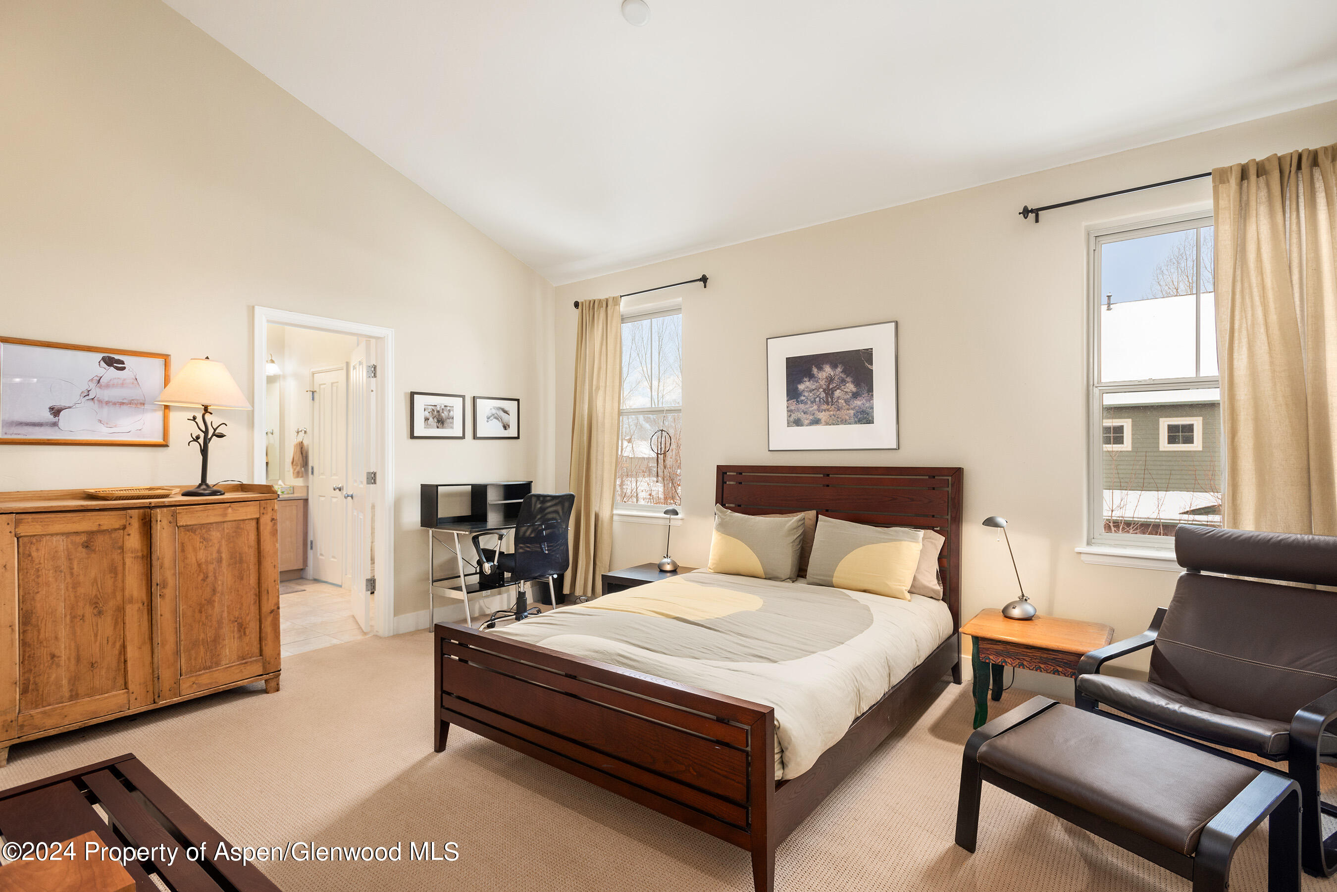 546 Evans Court Basalt, CO 81621 - Photo 6 of 13 a bedroom with a bed and wooden floor