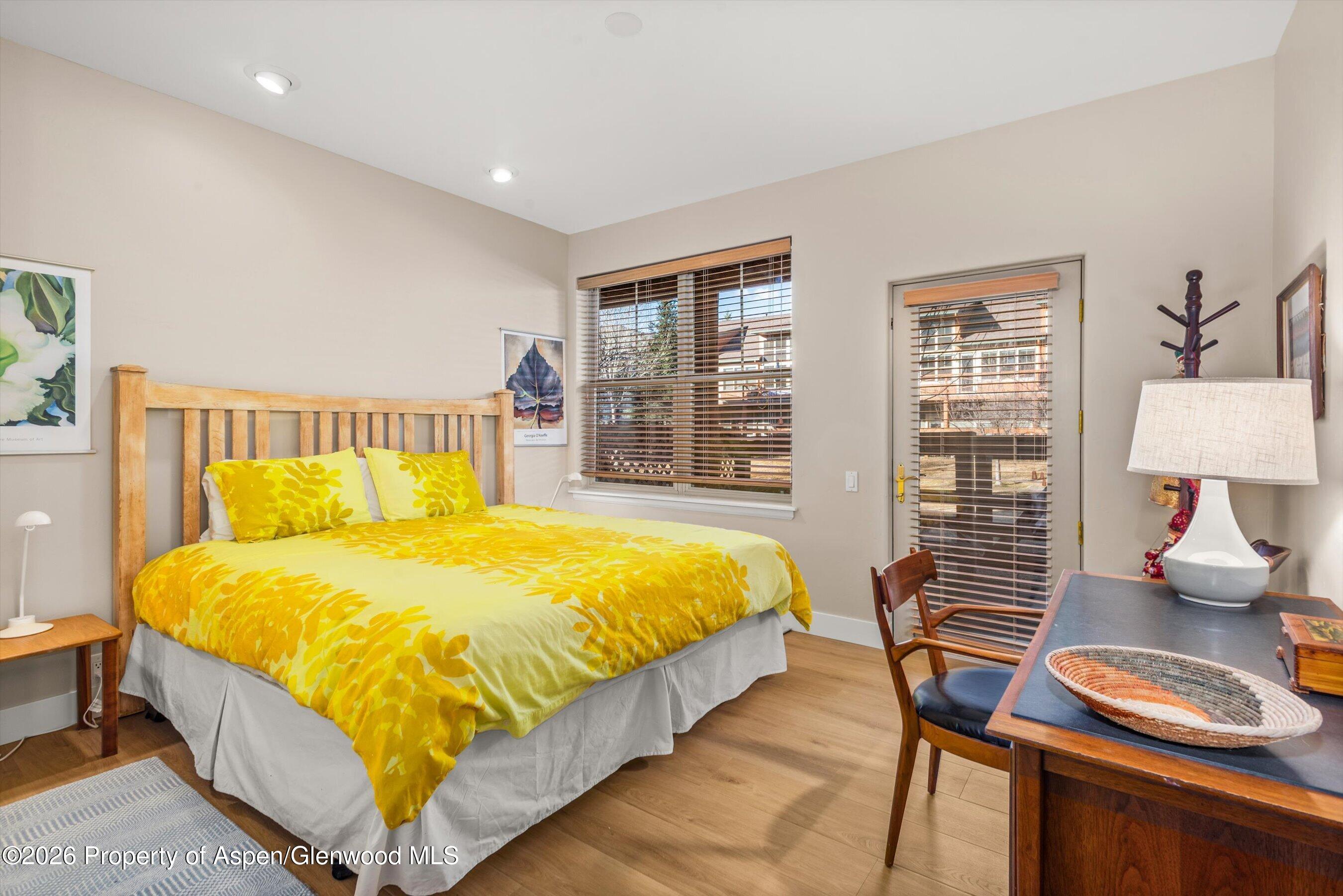 546 Evans Court Basalt, CO 81621 - Photo 7 of 13 a bedroom with a bed and wooden floor