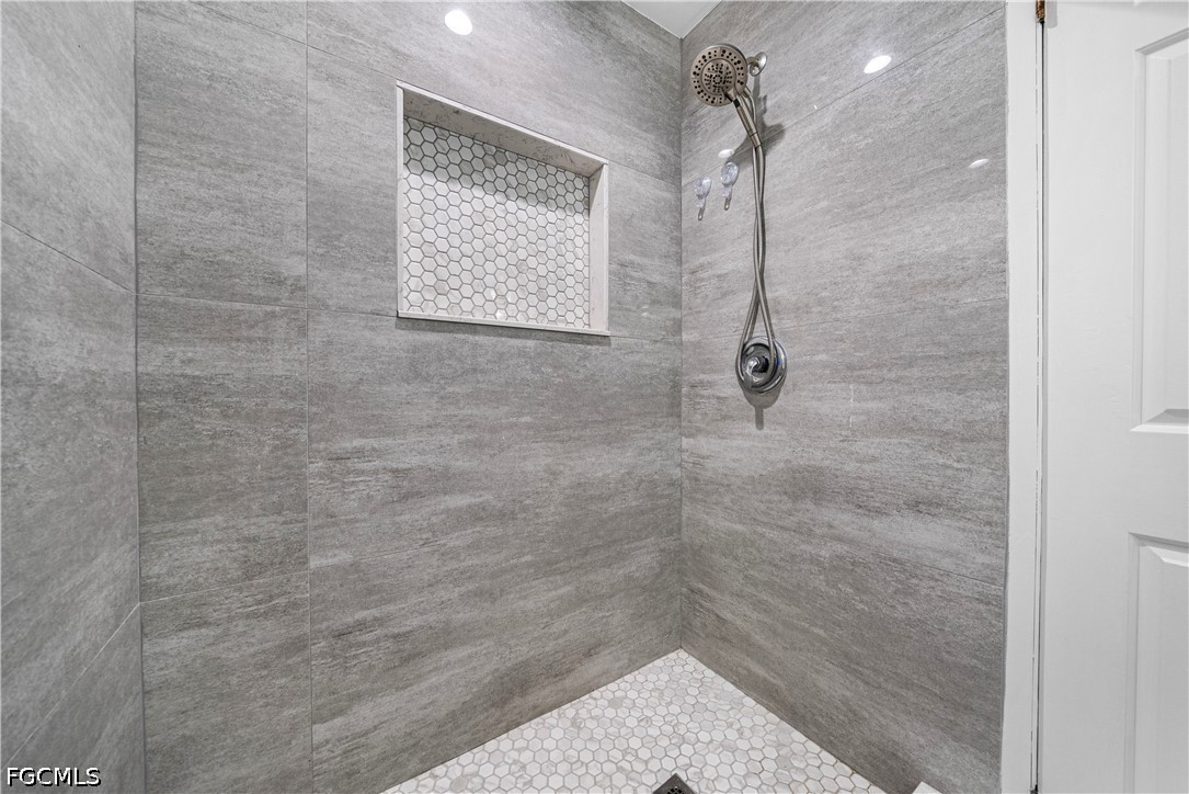2335 50th Terrace Southwest Naples, FL 34116 - Photo 12 of 26 a bathroom with a shower