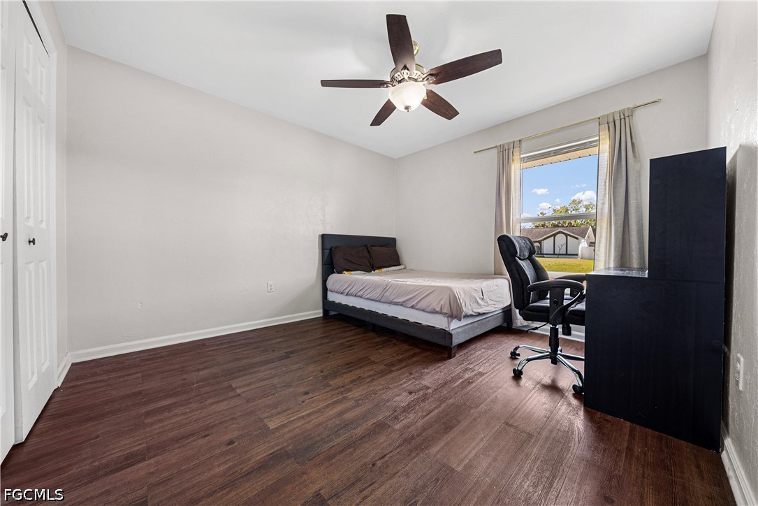 2335 50th Terrace Southwest Naples, FL 34116 - Photo 13 of 26 a bedroom with a bed and a desk