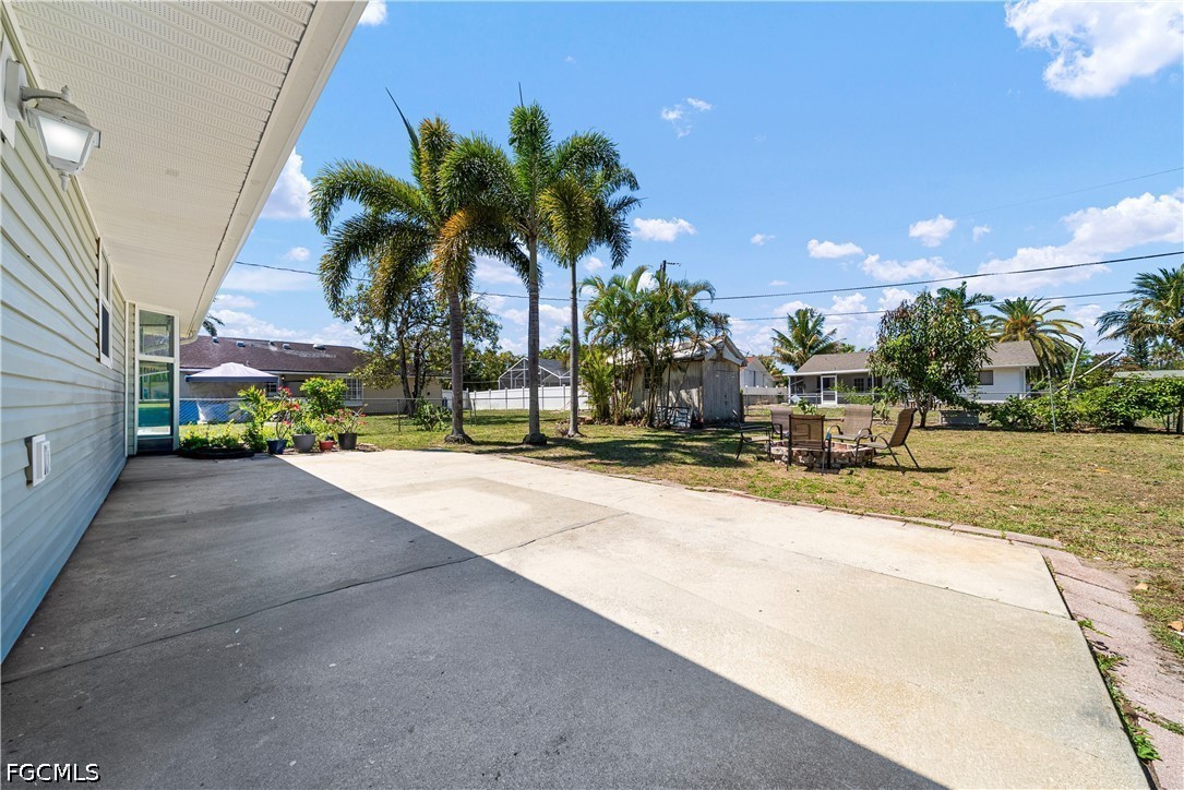 2335 50th Terrace Southwest Naples, FL 34116 - Photo 16 of 26 a view of a house with outdoor space and palm trees
