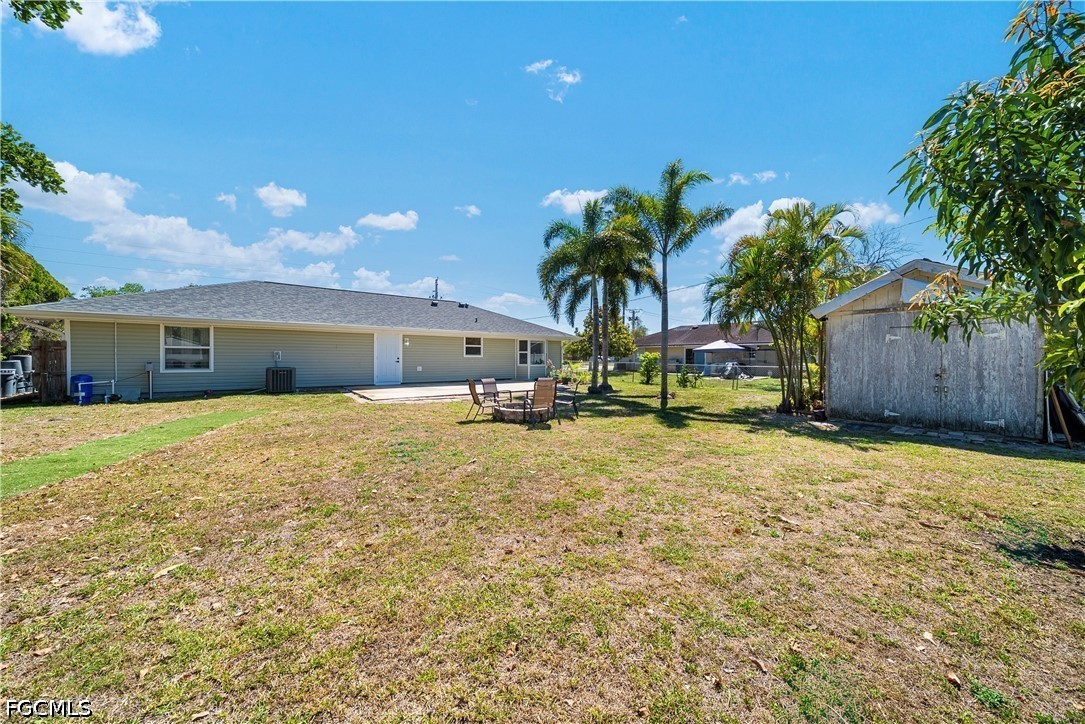 2335 50th Terrace Southwest Naples, FL 34116 - Photo 18 of 26 a front view of house with small garden