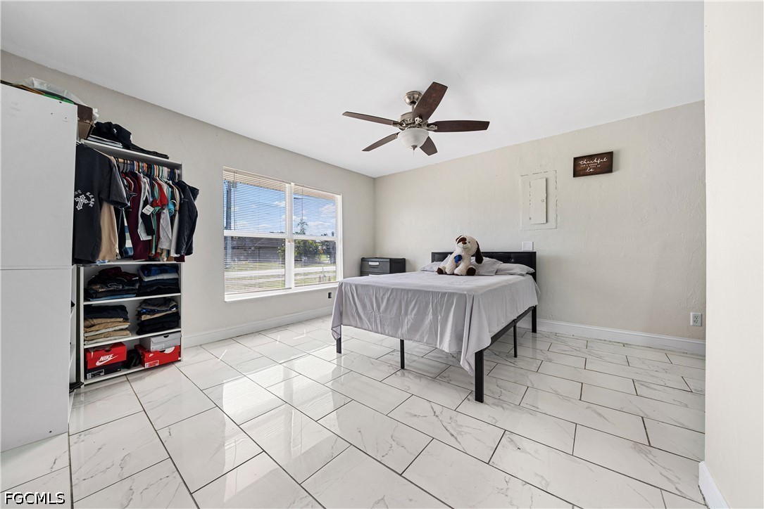 2335 50th Terrace Southwest Naples, FL 34116 - Photo 10 of 26 a living room with furniture and a window