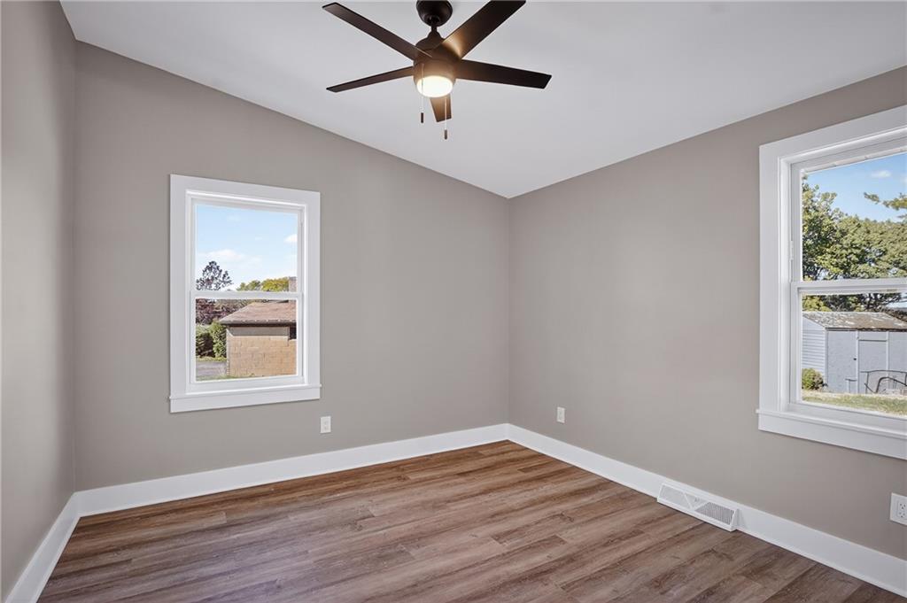 10390 Meinert Road Wexford, PA 15090 - Photo 22 of 42 a view of an empty room with window and wooden floor