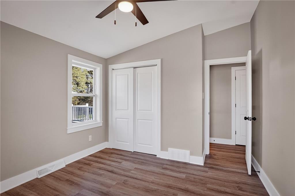 10390 Meinert Road Wexford, PA 15090 - Photo 23 of 42 a view of an empty room with wooden floor and a window