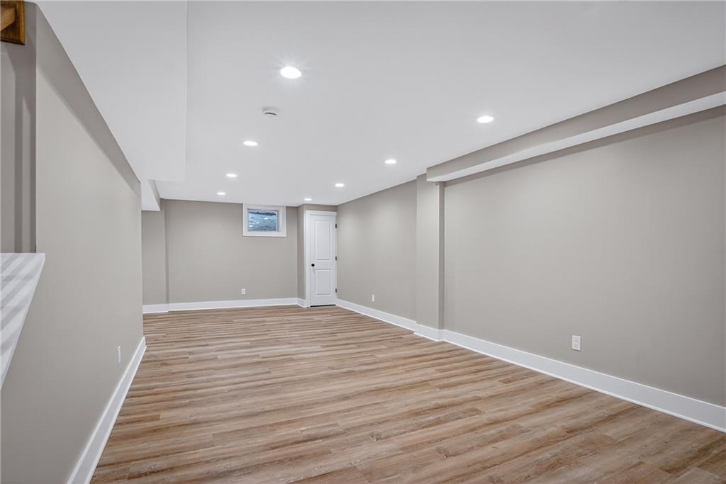 10390 Meinert Road Wexford, PA 15090 - Photo 28 of 42 a view of an empty room with wooden floor and entryway